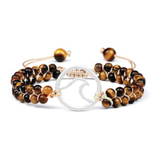 Natural Tiger Eye beaded wrist bracelet with charm for daily jewelry wear, spiritual styling, and casual accessorizing.
