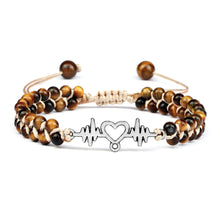Natural Tiger Eye gemstone bracelet with dangle charm for crystal-inspired styling, layered jewelry looks, and daily wear.
