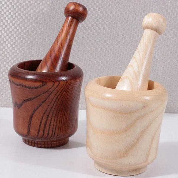 Natural Wood Mortar & Pestle grinding bowl set for crushing herbs, spices, and garlic in everyday kitchen use.