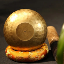 Nepal Tibetan singing bowl meditation set with metal bowl, wooden striker, and cushion for yoga, meditation, and calming rituals.