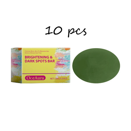 OceAura Daily Brightening Body Soap bar with packaging and green olive oil bar on white background.