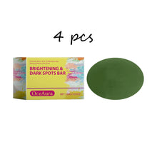 OceAura Daily Brightening Body Soap packaging with green disc soap bar on white background.