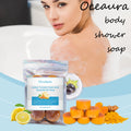 OceAura Lemon Turmeric Brightening Soap Bar packaging with woman in bathtub and ingredients displayed.