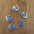 Om charm in red for jewelry making, meditation malas, and spiritual accessories.