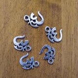 Om charm in red for jewelry making, meditation malas, and spiritual accessories.