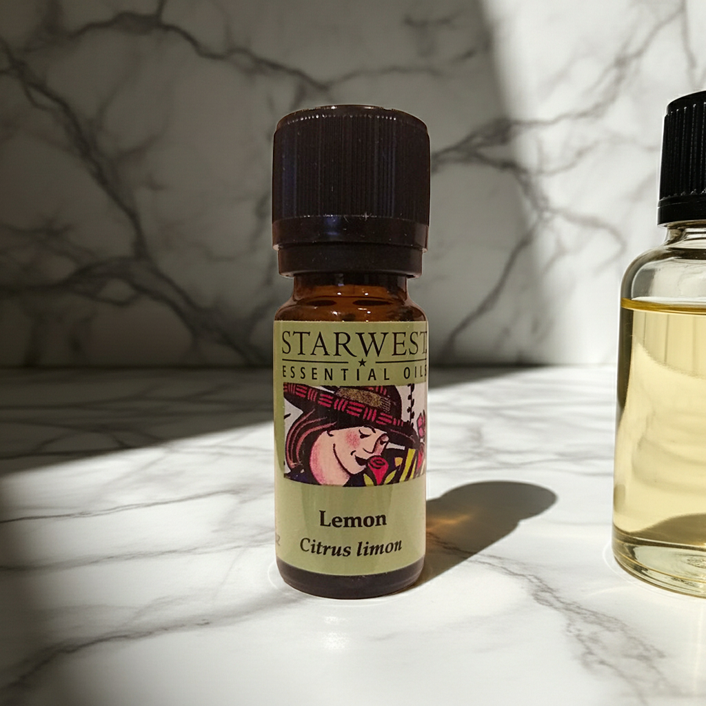 Starwest Botanicals organic lemon essential oil bottle for natural cleaning, aromatherapy blending, and invigorating home scenting.