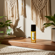Oud body oil bottle for moisturizing skin, softening dry areas, and daily body care.