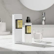 OUHOE Brightening Snail Mucin Essence bottle for smoothing skin texture, softening dry areas, and everyday skincare use.