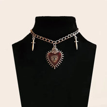 Peach heart cross sword gothic choker necklace for Y2K-inspired looks, streetwear styling, and layered accessory fashion.