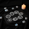 Pendulum mat with seven chakras design for dowsing, divination practice, and pendulum readings.