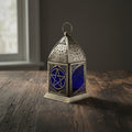 Pentacle glass and metal lantern for candle display, altar decor, and ambient lighting.