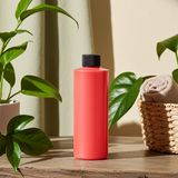 Peppermint scented body oil bottle for moisturizing skin, soothing massage, and refreshing body use.