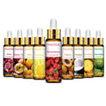 PHATOIL fruit fragrance oils in amber bottles with fitted droppers and fruit-photo labels, including cherry, passion fruit, mango, strawberry, papaya, coconut, pineapple and watermelon.