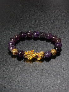 Pi Xiu charm Obsidian money bracelet for wealth attraction, protective energy, and feng shui styling.