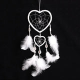 Pink and purple dreamcatcher hanging decor for bedroom styling, sleep space decoration, and boho wall arrangement.
