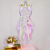 Pink and Purple Dream Catcher with feather hanging accents for sleep space decoration, positive energy, and calming room decor.