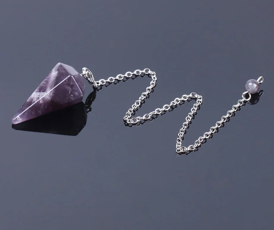 Pink Quartz Crystal Pendulum for dowsing, divination, and energy work.