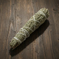 Prosperity Smudge Stick with pine and mountain sage for abundance rituals and space clearing.