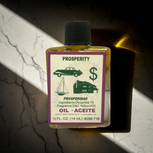 Prosperity Wish Oil bottle for money drawing spells, prosperity prayer, and manifestation practice.