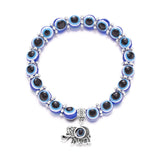Protective evil eye charm bracelet for spiritual symbolism, everyday outfit styling, and personal accessory use.