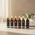 MAYJAM 10ml essential oil bottles in amber glass with colour-coded labels and gold dropper caps.
