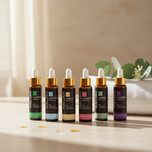 MAYJAM 10ml essential oil bottles in amber glass with colour-coded labels and gold dropper caps.