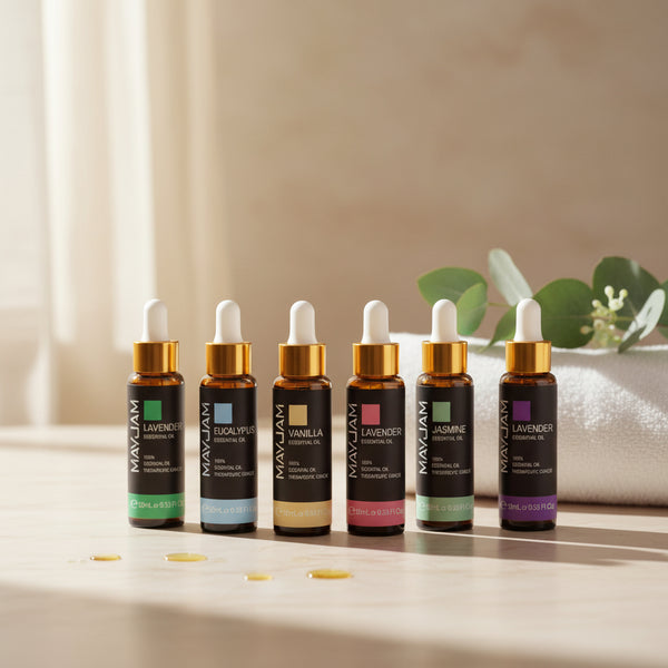 MAYJAM 10ml essential oil bottles in amber glass with colour-coded labels and gold dropper caps.