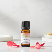 Pure rose essential oil dropper bottle for aromatherapy blends, romantic home fragrance, and premium skincare use.