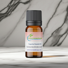 Tangerine essential oil dropper bottle for uplifting aromatherapy blends, evening relaxation, and sweet citrus home scenting.