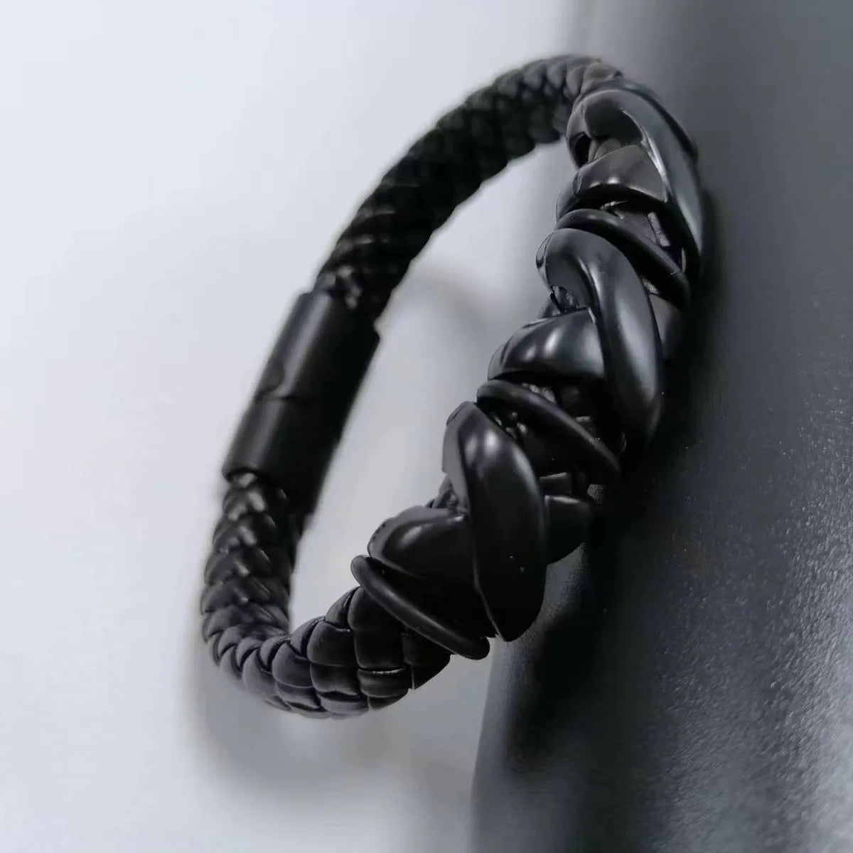Red black leather cuff bracelet for punk look styling, rock-themed outfits, and statement fashion wear.