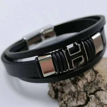 Red black leather wrist cuff bracelet for punk style outfits, casual alternative wear, and expressive accessorizing.