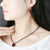 Red garnet grape necklace pendant with gemstone cluster form for accessorizing dresses, evening looks, and casual wear.