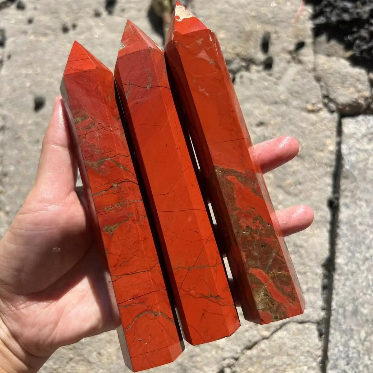 Large Red Jasper Crystal Obelisk grounding red jasper stone for vitality work and spiritual altar display.