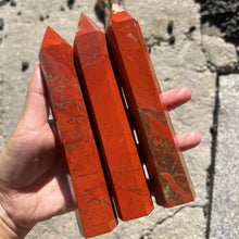 Large Red Jasper Crystal Obelisk grounding red jasper stone for vitality work and spiritual altar display.