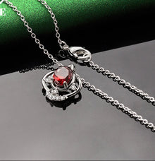 Red zircon sterling silver bud necklace pendant for elegant outfit pairing, festive wear, and jewelry gifting.