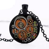 Reiki symbol steampunk glass pendant for spiritual jewelry wear, chakra work, and holistic healing use.