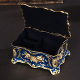 Retro metal jewelry trinket box for holding earrings, rings, and treasured keepsakes.