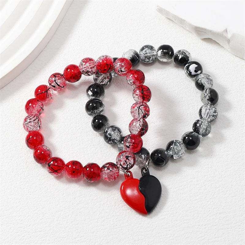 Romantic magnetic couple bracelet set with heart-shaped connecting charm for boyfriend and girlfriend wear, date-night styling, and love-themed gifts.