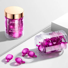 Rose Essence Hair Serum Capsules pink cosmetic product with packaging on white background.