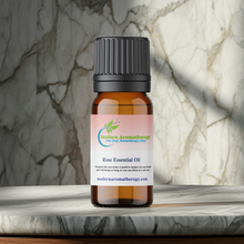 Rose aromatherapy essential oil bottle for grounding rituals, perfume blending, and luxurious home fragrance use.