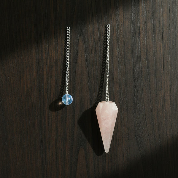 Rose Quartz pendulum crystal divination tool for dowsing, spiritual guidance, and energy work.