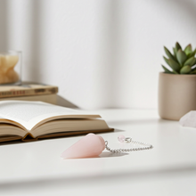 Rose Quartz pendulum gemstone tool for dowsing, yes-or-no readings, and spiritual insight.
