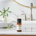 Rosemary essential oil bottle for focus-supporting aromatherapy, hair care blending, and invigorating diffuser use.