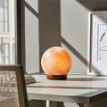 Round Natural Himalayan Salt Lamp crystal lamp for warm ambient lighting, home decor, and relaxation use.
