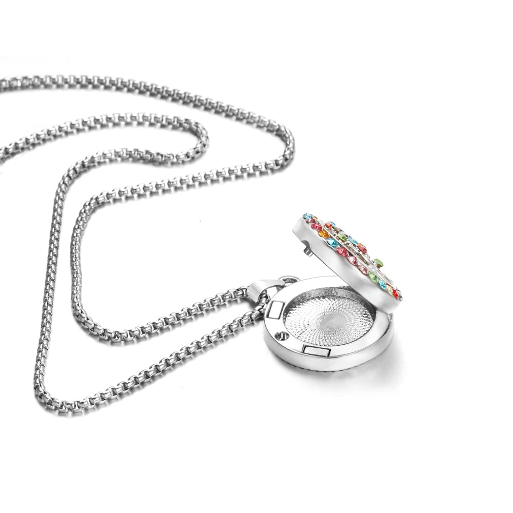Round Tree of Life aromatherapy locket pendant for carrying essential oils, stress relief, and daily wellness support.