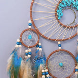 Rustic Tree of Life dream catcher hanging for nursery decoration, bedroom styling, and spiritual home decor.