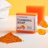 SAUVASINE Turmeric Handmade Soap for dark spots with turmeric root and powder on white background.