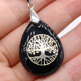 Seven Chakra water drop crystal stone pendant for meditation practice, energy healing, and symbolic daily wear.