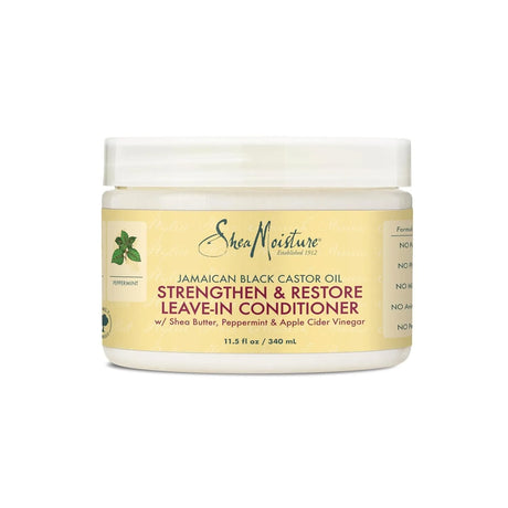 SheaMoisture Jamaican Black Castor Oil Strengthen and Restore Leave-In Conditioner jar on white background.