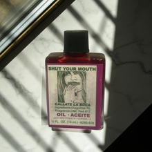 Shut Your Mouth Wish Oil dressing oil bottle for candle work, petition rituals, and silence-focused spell use.